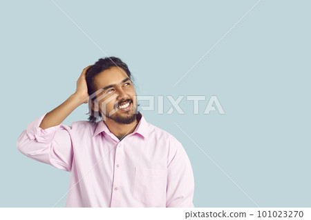 Man with funny facial expression is trying to remember what he forgot by looking at copy space. Man with funny facial expression is trying to remember what he forgot by looking at copy space. 101023270