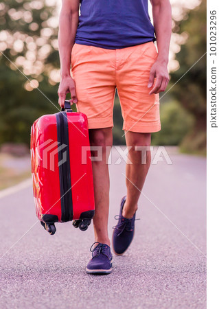 Unrecognizable mid adult male with travel baggage transportation. Alone for future aspirations. Unrecognizable mid adult male with travel baggage transportation. Alone for future aspirations. 101023296