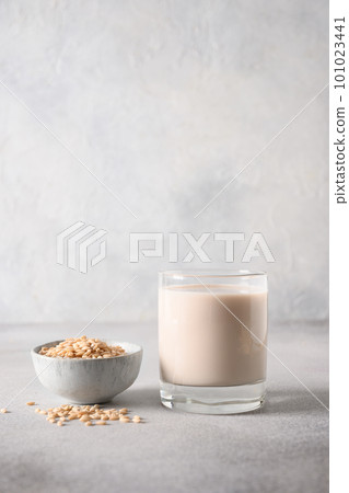 Barley milk in glass with spikelet of barley. 101023441