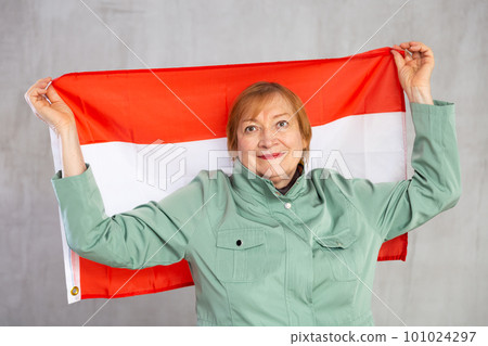 Cheerful senior woman standing confidently with austrian flag Cheerful senior woman standing confidently with austrian flag 101024297