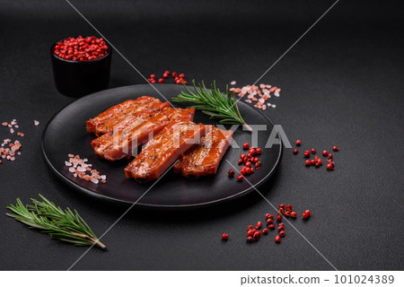 Grilled fresh juicy ribs with salt, spices and herbs 101024389