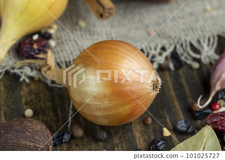 onion bulb and other spices on the table while cooking dishes 101025727