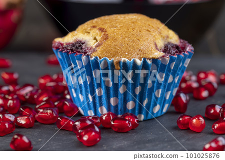 Wheat fresh cupcake with cherry and red pomegranate Wheat fresh cupcake with cherry and red pomegranate 101025876