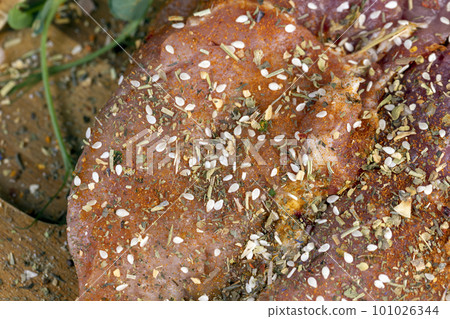 Pork meat pieces marinated with spices and salt 101026344