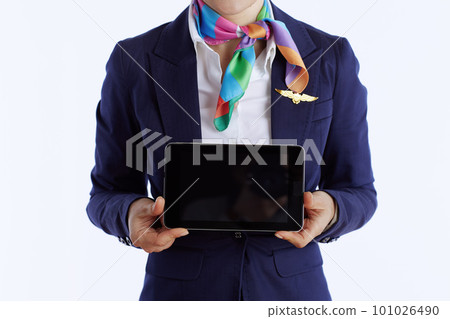 Elegant flight attendant woman on showing tablet PC blank screen Elegant flight attendant woman on showing tablet PC blank screen 101026490