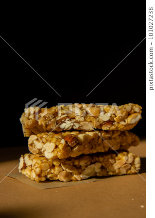 Homemade Granola energy bar. Variety of homemade protein granola breakfast bars with nuts, raisins dried cherries and chocolate. Healthy nutrition eating Gluten free cereal dieting snack super food Homemade Granola energy bar. Variety of homemade protein granola breakfast bars with nuts, raisins dried cherries and chocolate. Healthy nutrition eating Gluten free cereal dieting snack super food 101027238
