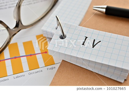 A desk with a deck of cards marked IV A desk with a deck of cards marked IV 101027665
