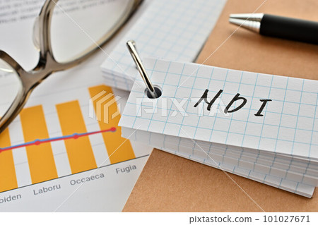 A desk with a word book written as NDI 101027671