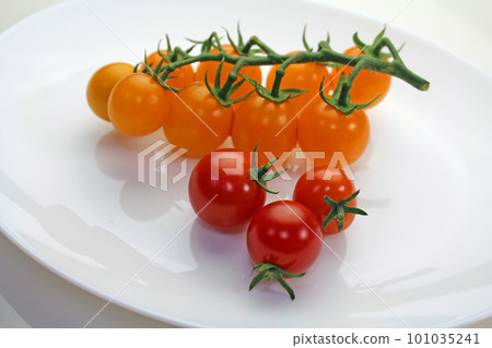 mini tomatoes on a white plate 101035241