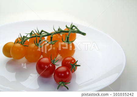 mini tomatoes on a white plate 101035242