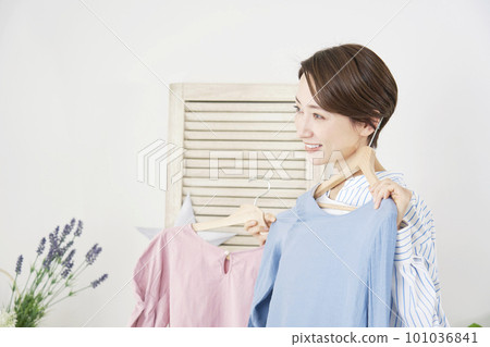 Woman choosing clothes at home 101036841