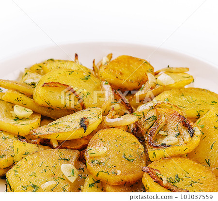 Fried potatoes with onions and garlic Fried potatoes with onions and garlic 101037559