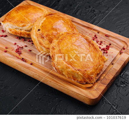 Homemade flaky pasty with mince meat filling 101037619