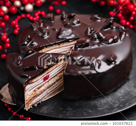 Freshly made delicious chocolate cake on marble table 101037621