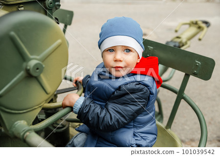Little boys playing with historical world war tank. Portrait of boy. 101039542