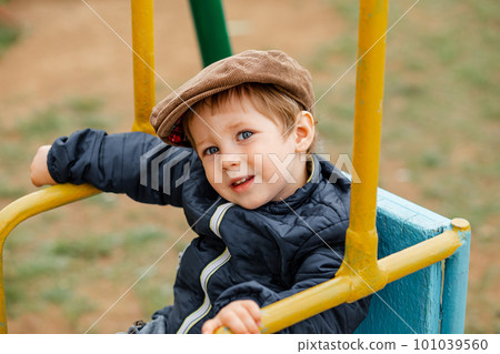 Child smiling and looking at camera. Funny portrait of kid. 101039560