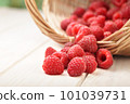 raspberry in a basket on the table 101039731