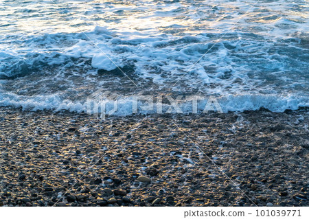 Sea Waves on Pebble Beach Texture Background Sea Waves on Pebble Beach Texture Background 101039771