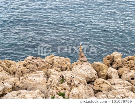 Stone pyramid. Pebbles balance pile, harmony zen stones, balance stack, sea pebble pyramid on shoreline, relaxation 101039799