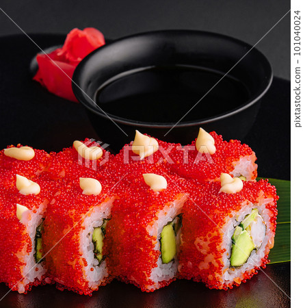 California Sushi roll cutting on black plate 101040024