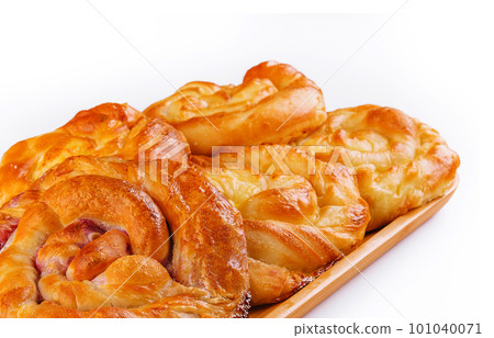 Buns with berry jam on wooden plate Buns with berry jam on wooden plate 101040071