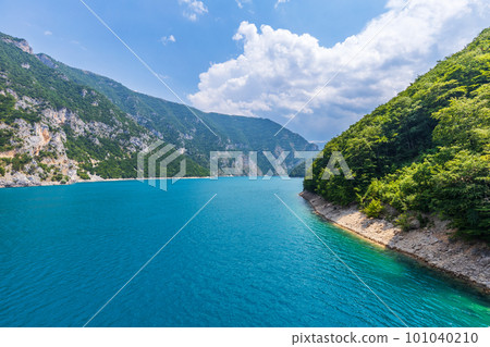 Wide angle view of Piva lake or Pivske Jezero in Montenegro at summer noon 101040210