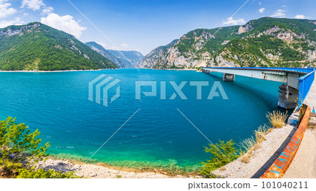 Wide angle view of Piva lake or Pivske Jezero in Montenegro at summer noon 101040211