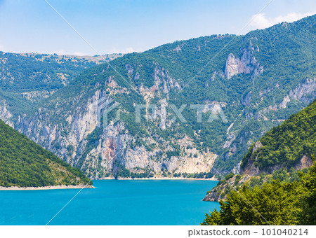 Landscape view of big lake between mountains at summer day 101040214
