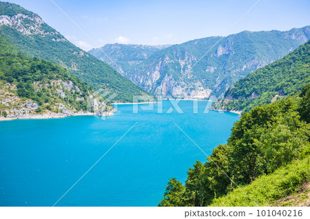 Landscape view of big lake between mountains at summer day 101040216