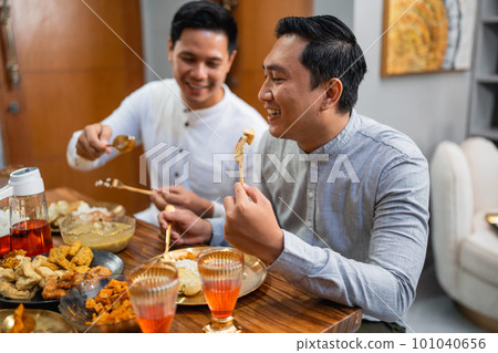 asian two male having dinner together asian two male having dinner together 101040656