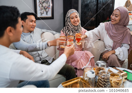 Muslim families get together celebrating Idul Fitri at home 101040685