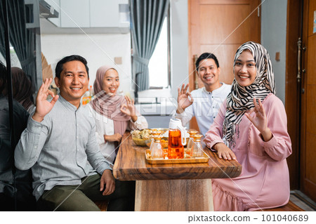 people having dinner together and showing thumb up gesture people having dinner together and showing thumb up gesture 101040689