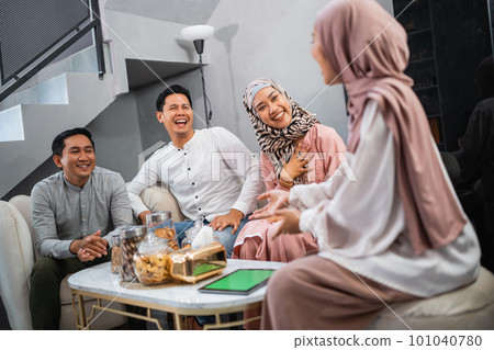 Muslim families get together celebrating Idul Fitri by at home 101040780
