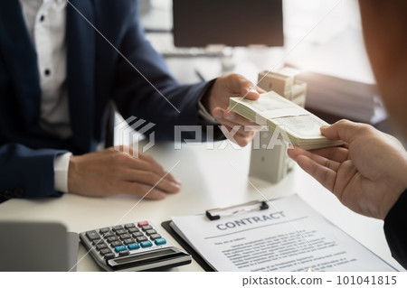 home loan officer receiving bribe money from business man the concept of corruption and anti bribery. home loan officer receiving bribe money from business man the concept of corruption and anti bribery. 101041815
