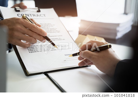 Real estate broker agent presenting and consult to customer to decision making sign insurance form agreement, home model, concerning mortgage loan offer. Real estate broker agent presenting and consult to customer to decision making sign insurance form agreement, home model, concerning mortgage loan offer. 101041818