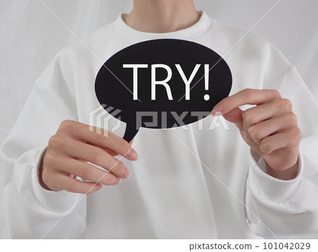 A man holding a card that says TRY 101042029