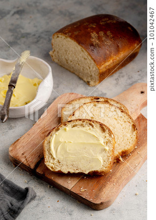 Sourdough square, homemade white loaf bread with butter.  101042467