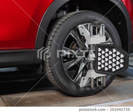 Alignment of car wheels in a car service. 101042739