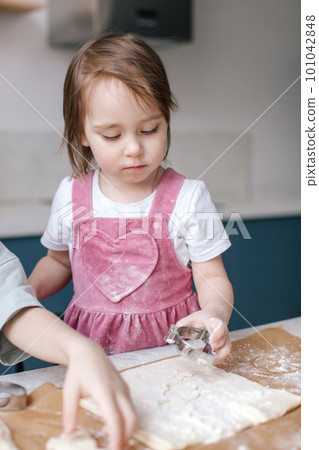 Girl making cookies, preparing Easter. Girl making cookies, preparing Easter. 101042848