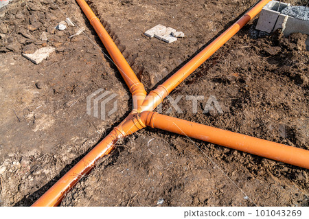 plastic pipe for sewage network in the base plate at the construction site plastic pipe for sewage network in the base plate at the construction site 101043269