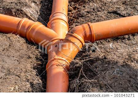 plastic pipe for sewage network in the base plate at the construction site plastic pipe for sewage network in the base plate at the construction site 101043271