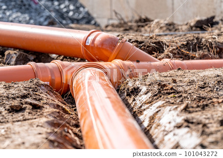 plastic pipe for sewage network in the base plate at the construction site plastic pipe for sewage network in the base plate at the construction site 101043272
