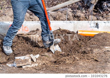digging in the ground for plastic pipes for water and waste. digging in the ground for plastic pipes for water and waste. 101043276