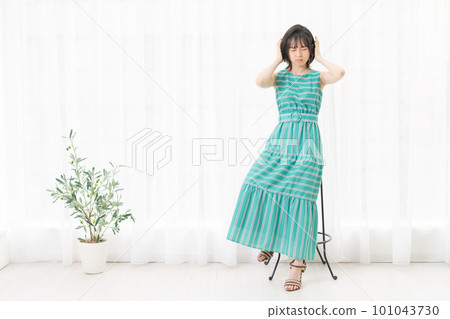 Young woman troubled by noise Young woman troubled by noise 101043730