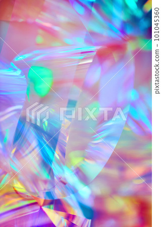 bright neon pink, purple, orange holographic metallic foil festive background 101045360
