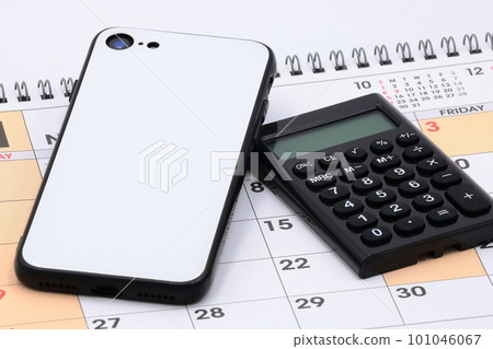Business-related image (smartphone and calculator) Business-related image (smartphone and calculator) 101046067