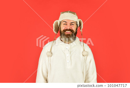 Sheep fur. Bearded funny hipster. Perfect accessory. Bearded man wear hat with ear flaps red background. Soft furry accessory. Caring fur garments. Winter fashion concept. Warm hat for cold weather Sheep fur. Bearded funny hipster. Perfect accessory. Bearded man wear hat with ear flaps red background. Soft furry accessory. Caring fur garments. Winter fashion concept. Warm hat for cold weather 101047717