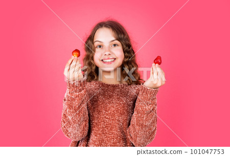 try it. diet and dieting. organic food only. Girl with strawberry. eating strawberry for breakfast. small kid eating berries. summer time childhood. Enjoying the moment. fruit full of vitamin 101047753