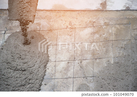 Concrete cement work for floor pouring with wire mesh at the construction agency 101049070