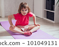 Child goes in for sports at home, home workout 101049131